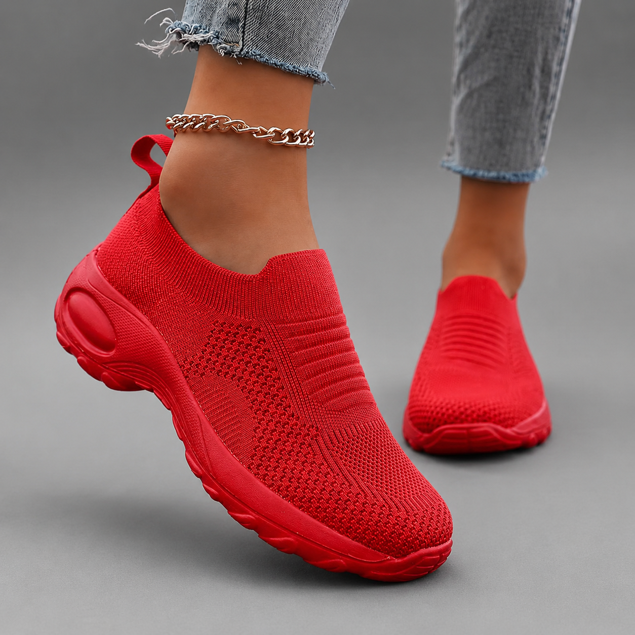 Women's orthopaedic slip-on trainers with a breathable stretch-knit upper, chunky cushioned sole and lightweight design, offering all-day comfort for walking, commuting, travel and everyday casual wear.