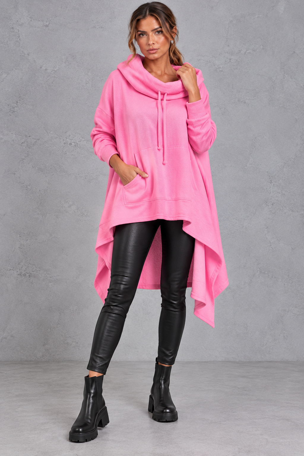 Women's pink oversized hoodie with asymmetric hanky hem – front view