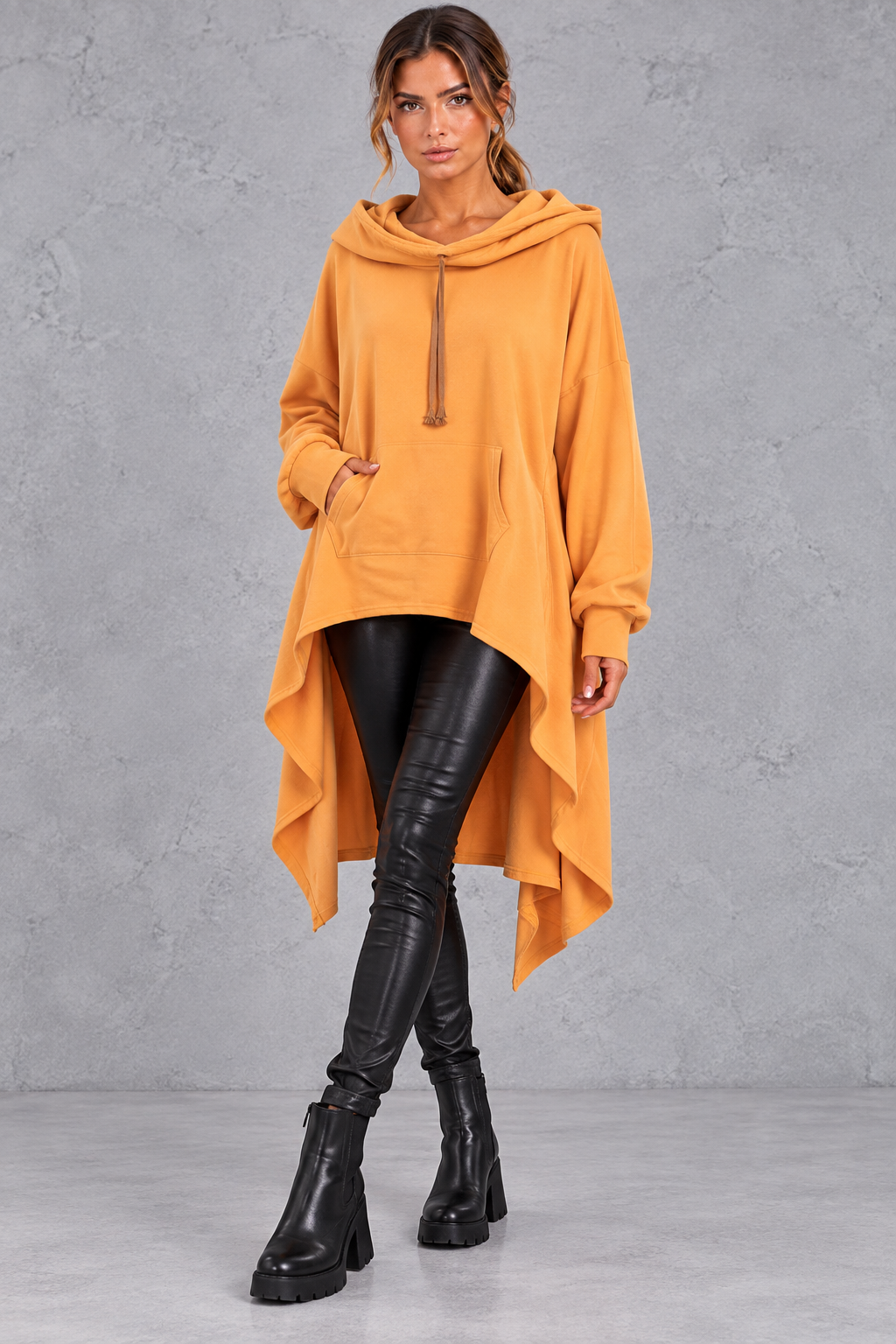 Women's yellow oversized hoodie with asymmetric hanky hem – front view