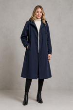 Women's oversized waterproof trench coat with a longline silhouette, adjustable drawstring hood, elasticated cuffs and lightweight water-repellent fabric, ideal for rainy weather and everyday wear.