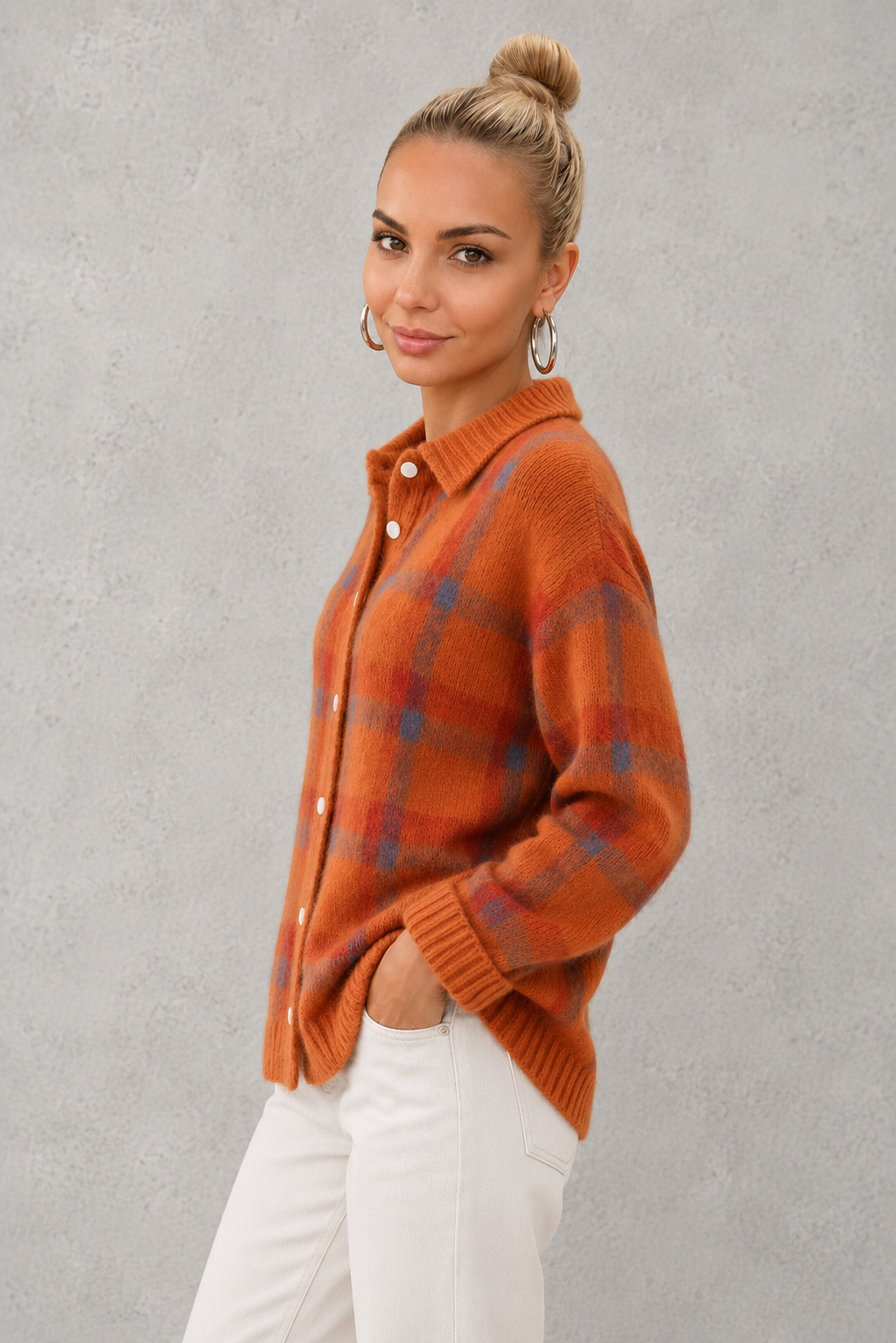 Women's plaid knit sweater with a classic check pattern, relaxed fit and soft knitted texture, offering lightweight warmth for casual everyday wear, layering and seasonal styling.
