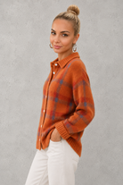 Women's plaid knit sweater with a classic check pattern, relaxed fit and soft knitted texture, offering lightweight warmth for casual everyday wear, layering and seasonal styling.