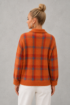 Women's plaid knit sweater with a classic check pattern, relaxed fit and soft knitted texture, offering lightweight warmth for casual everyday wear, layering and seasonal styling.