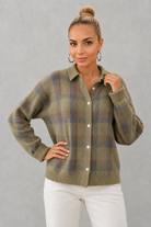 Women's plaid knit sweater with a classic check pattern, relaxed fit and soft knitted texture, offering lightweight warmth for casual everyday wear, layering and seasonal styling.