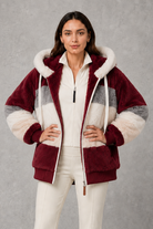 Women’s plush hooded winter coat with soft faux fur panels, a relaxed silhouette and rib-knit cuffs for cosy cold-weather layering.