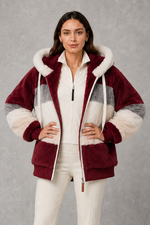 Women’s plush hooded winter coat with soft faux fur panels, a relaxed silhouette and rib-knit cuffs for cosy cold-weather layering.