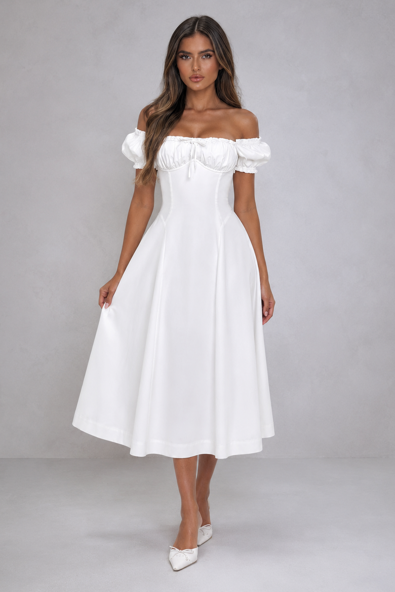 Woman wearing a white off-shoulder dress on a gray background