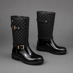 Women's quilted plaid mid-calf rain boots with a waterproof PVC upper, decorative side buckle, round toe and non-slip rubber sole, designed as comfortable slip-on Wellington boots for rainy days, gardening and outdoor wear.