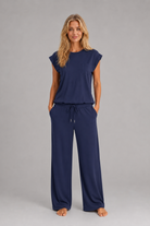 Women's relaxed two-piece lounge set featuring a cap sleeve T-shirt with chest pocket and matching wide leg trousers with an elasticated drawstring waist, crafted from soft breathable fabric for everyday comfort.