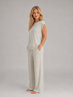 Women's relaxed two-piece lounge set featuring a cap sleeve T-shirt with chest pocket and matching wide leg trousers with an elasticated drawstring waist, crafted from soft breathable fabric for everyday comfort.