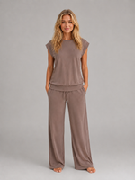 Women's relaxed two-piece lounge set featuring a cap sleeve T-shirt with chest pocket and matching wide leg trousers with an elasticated drawstring waist, crafted from soft breathable fabric for everyday comfort.