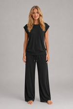 Women's relaxed two-piece lounge set featuring a cap sleeve T-shirt with chest pocket and matching wide leg trousers with an elasticated drawstring waist, crafted from soft breathable fabric for everyday comfort.