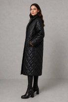 Women’s reversible quilted mid-length coat with a classic plain quilted side and bold leopard-print reverse, featuring lapels and side pockets.