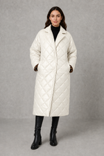 Women’s reversible quilted mid-length coat with a classic plain quilted side and bold leopard-print reverse, featuring lapels and side pockets.