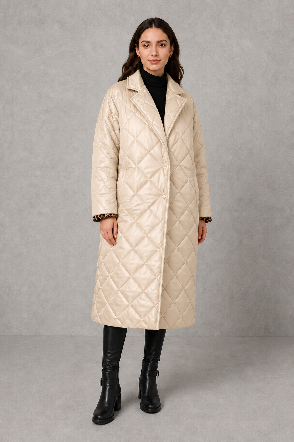 Women’s reversible quilted mid-length coat with a classic plain quilted side and bold leopard-print reverse, featuring lapels and side pockets.