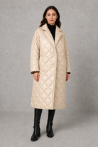 Women’s reversible quilted mid-length coat with a classic plain quilted side and bold leopard-print reverse, featuring lapels and side pockets.