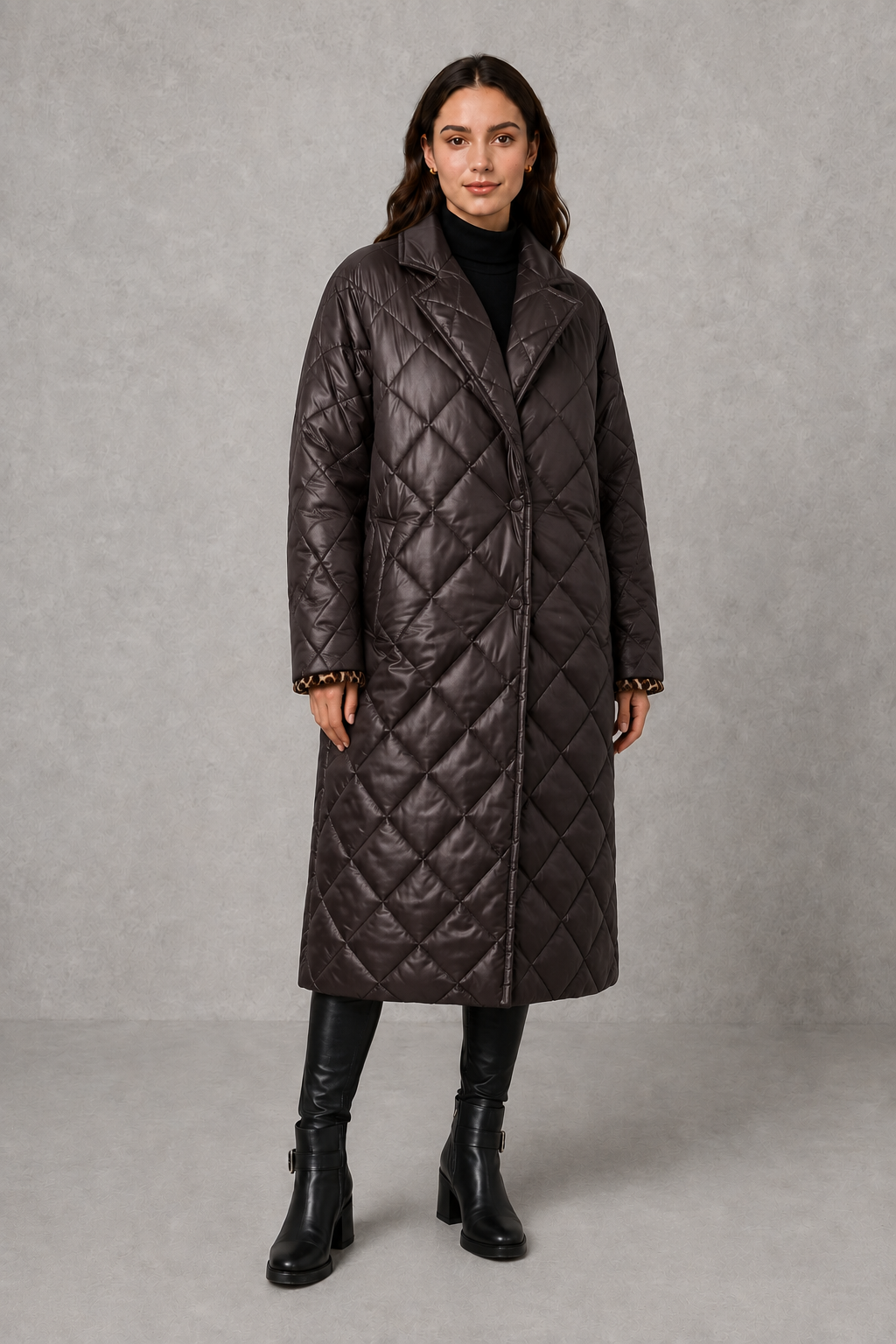 Women’s reversible quilted mid-length coat with a classic plain quilted side and bold leopard-print reverse, featuring lapels and side pockets.
