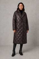 Women’s reversible quilted mid-length coat with a classic plain quilted side and bold leopard-print reverse, featuring lapels and side pockets.