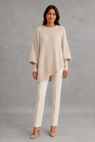 Women’s ribbed high neck knit jumper with long sleeves and a relaxed, softly draped silhouette for autumn and winter wear.