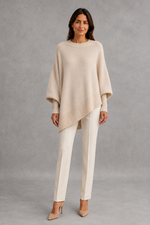 Women’s ribbed high neck knit jumper with long sleeves and a relaxed, softly draped silhouette for autumn and winter wear.