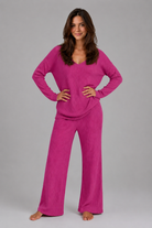 Women's ribbed knit lounge set featuring a relaxed V-neck jumper and matching wide leg trousers in a soft stretch knit, designed for cosy everyday comfort and casual wear.