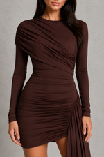 Brown long-sleeve dress with draped design on a gray background