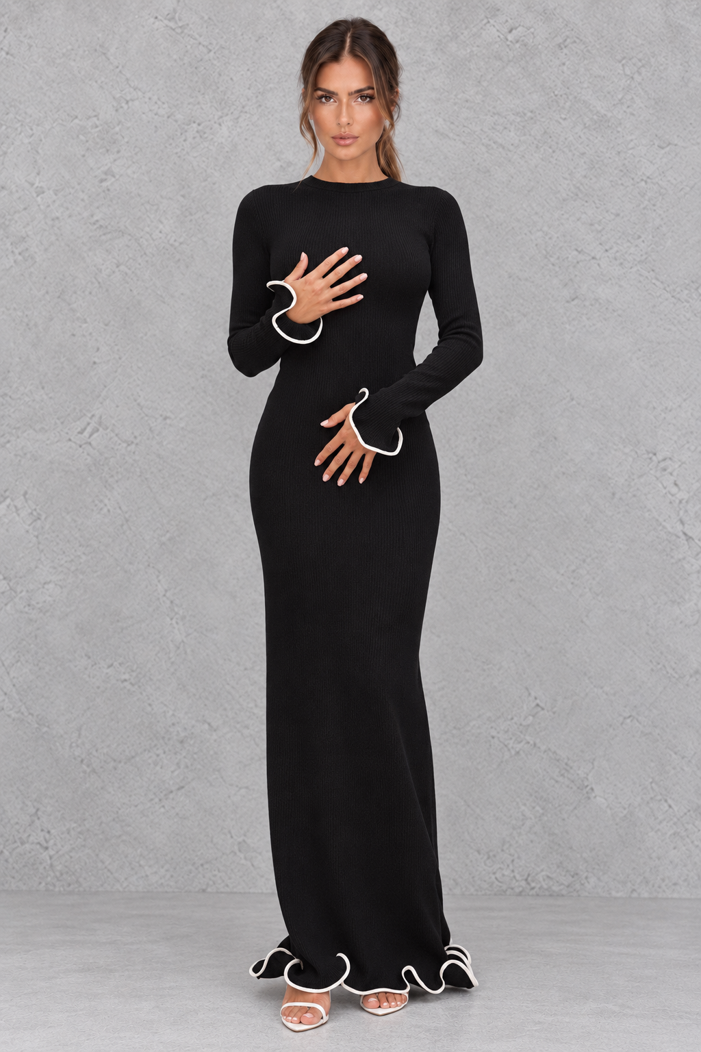 Women’s ruffle knit maxi evening dress with long flared sleeves, textured detailing and a dramatic backless design.