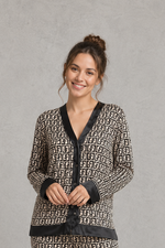 Women's brown satin two-piece pyjama set with a geometric print, long sleeve button-up V-neck top and matching full-length trousers.