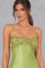 Women’s sequin tassel mini dress with a square neckline, delicate spaghetti straps, shimmering embellishments and playful tassel detailing.