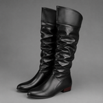 Women's black slouch knee-high boots with a low block heel, smooth PU leather upper, relaxed slouch design and durable rubber sole, ideal for everyday autumn and winter wear.