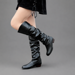 Women's black slouch knee-high boots with a low block heel, smooth PU leather upper, relaxed slouch design and durable rubber sole, ideal for everyday autumn and winter wear.