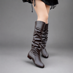 Women's black slouch knee-high boots with a low block heel, smooth PU leather upper, relaxed slouch design and durable rubber sole, ideal for everyday autumn and winter wear.
