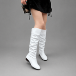Women's black slouch knee-high boots with a low block heel, smooth PU leather upper, relaxed slouch design and durable rubber sole, ideal for everyday autumn and winter wear.