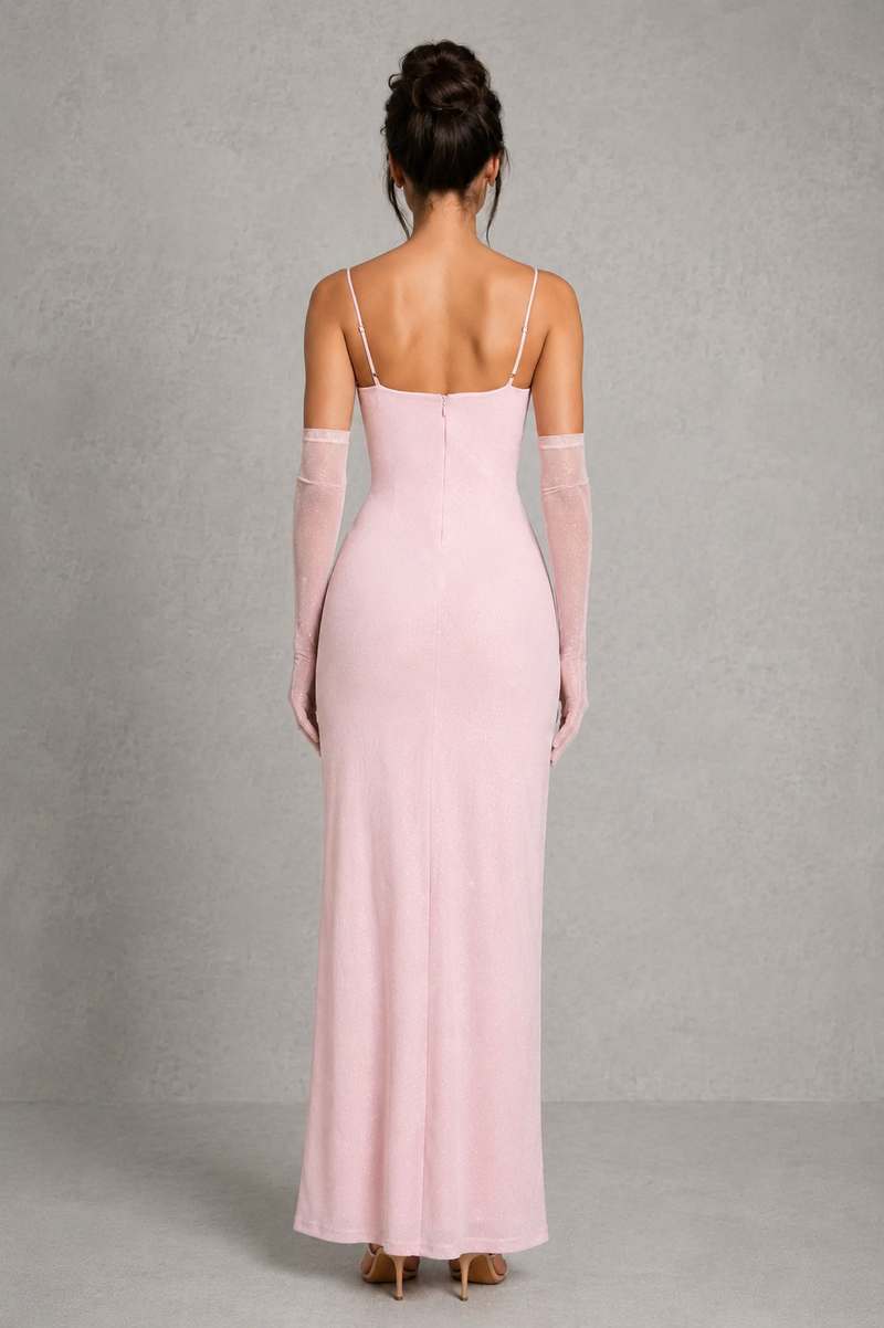 Pink evening gown with sheer sleeves on a gray background
