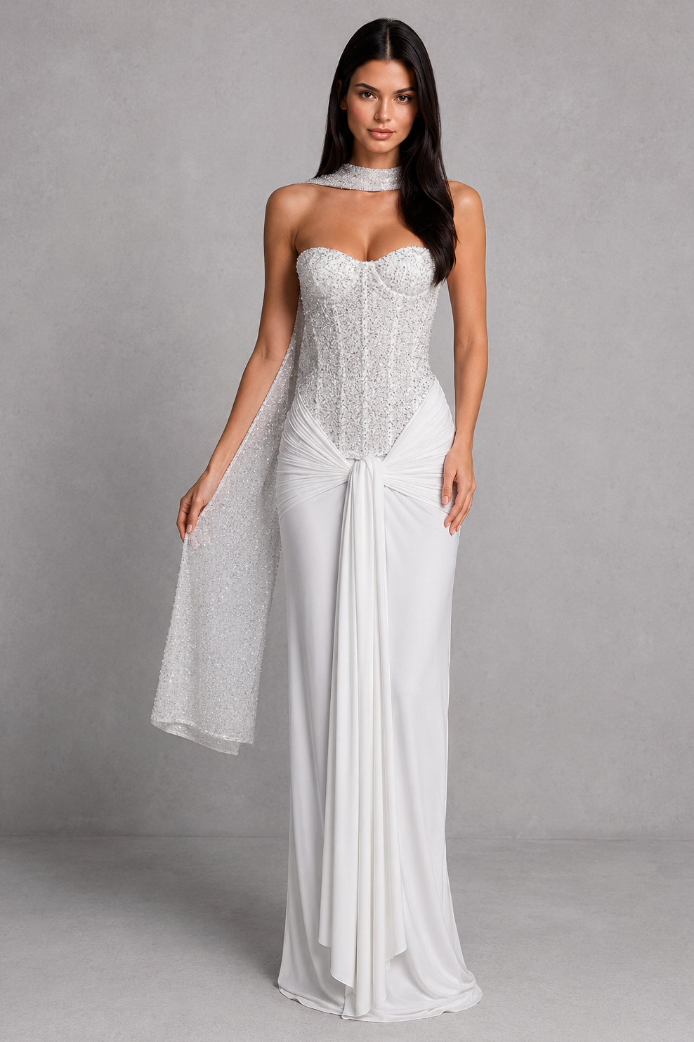 Woman wearing a strapless white gown with a gray background
