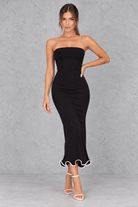 Women’s strapless ruched bodycon midi dress with wrap-style detailing, a fitted silhouette and feminine ruffle hem.