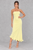 Women’s strapless ruched bodycon midi dress with wrap-style detailing, a fitted silhouette and feminine ruffle hem.