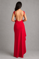 Red evening gown with open back on a gray background