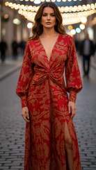 Woman wearing a red patterned dress on a blurred street background