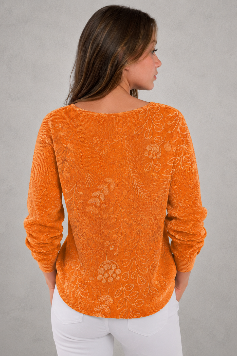 Woman wearing a patterned V-neck top with an autumn-inspired print, featuring a relaxed fit, lightweight breathable fabric, and long sleeves. Styled for casual everyday wear with a flattering feminine silhouette, suitable for pairing with jeans, trousers, skirts, or leggings.