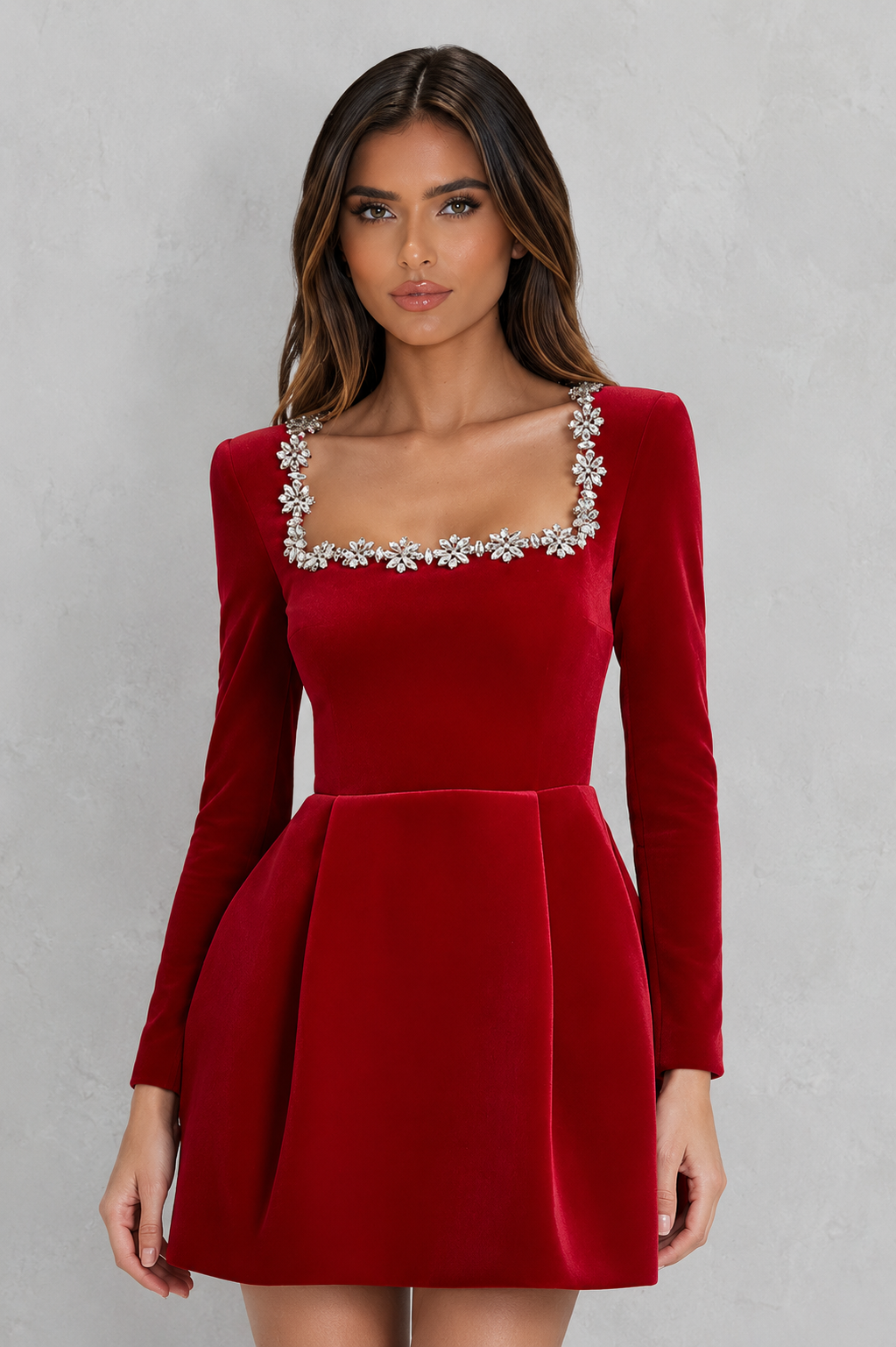 Red dress with silver embellishments on a gray background