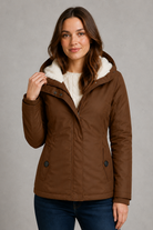 Women's waterproof hooded longline coat with a warm insulated lining, adjustable hood, and elegant longline design, offering reliable all-weather protection for everyday wear, commuting, travel, and outdoor walks.