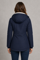 Women's waterproof hooded longline coat with a warm insulated lining, adjustable hood, and elegant longline design, offering reliable all-weather protection for everyday wear, commuting, travel, and outdoor walks.