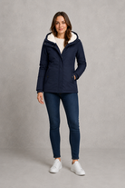 Women's waterproof hooded longline coat with a warm insulated lining, adjustable hood, and elegant longline design, offering reliable all-weather protection for everyday wear, commuting, travel, and outdoor walks.