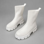Women's waterproof stretch ankle boots with a flexible synthetic upper, warm faux fur lining, lace-up detailing, slip-on design and non-slip rubber sole for comfortable everyday autumn and winter wear.