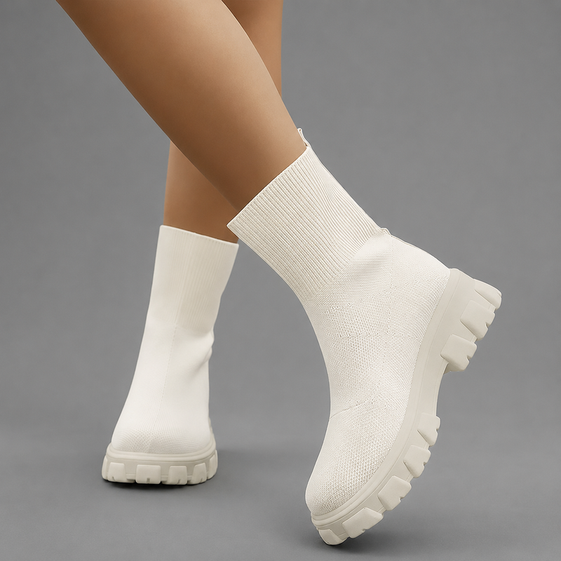 Women's waterproof stretch ankle boots with a flexible synthetic upper, warm faux fur lining, lace-up detailing, slip-on design and non-slip rubber sole for comfortable everyday autumn and winter wear.
