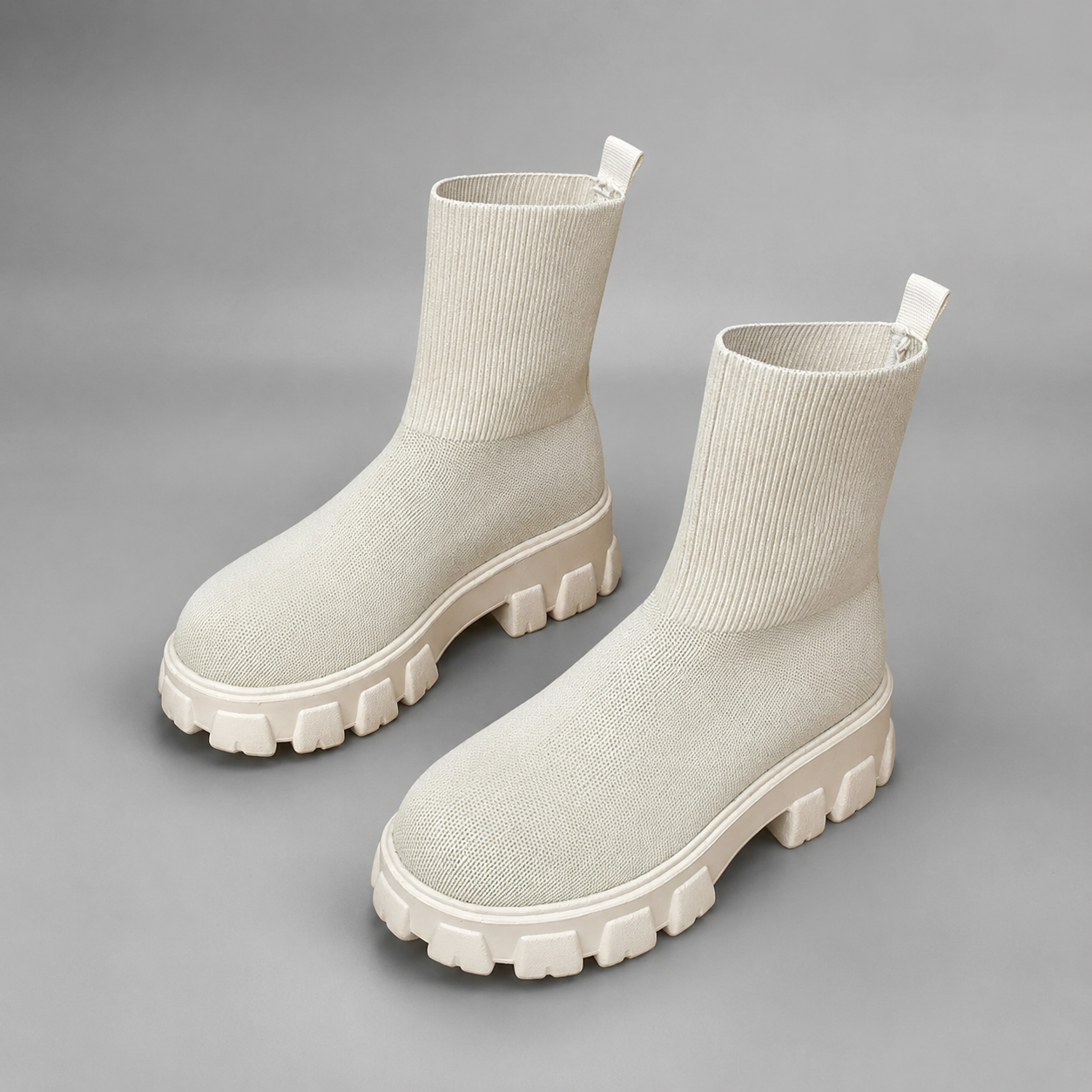 Women's waterproof stretch ankle boots with a flexible synthetic upper, warm faux fur lining, lace-up detailing, slip-on design and non-slip rubber sole for comfortable everyday autumn and winter wear.
