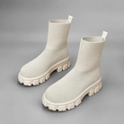 Women's waterproof stretch ankle boots with a flexible synthetic upper, warm faux fur lining, lace-up detailing, slip-on design and non-slip rubber sole for comfortable everyday autumn and winter wear.
