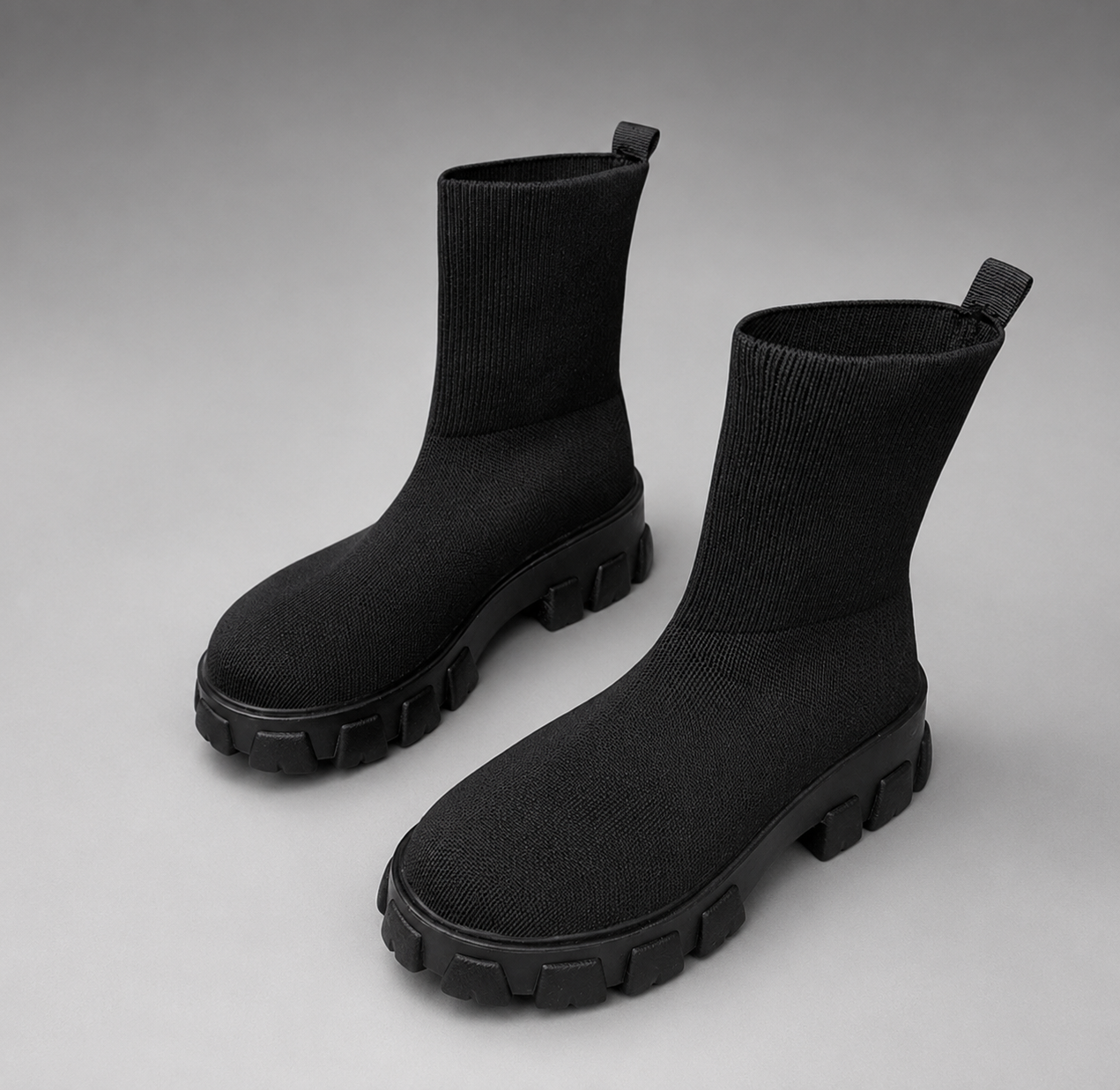 Women's waterproof stretch ankle boots with a flexible synthetic upper, warm faux fur lining, lace-up detailing, slip-on design and non-slip rubber sole for comfortable everyday autumn and winter wear.