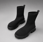 Women's waterproof stretch ankle boots with a flexible synthetic upper, warm faux fur lining, lace-up detailing, slip-on design and non-slip rubber sole for comfortable everyday autumn and winter wear.